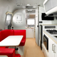 A photo of the kitchen and seating area in the Supreme Airstream.